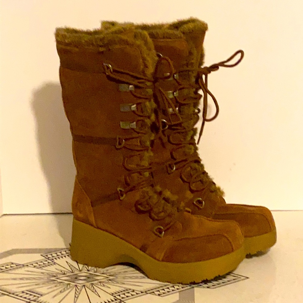 Brown suede platform lace up boots.